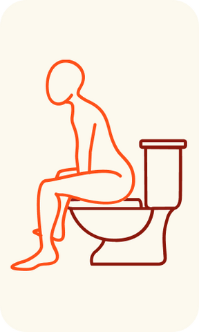 Sitting on a toilet