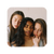 Two white people on the shoulder of a brown person while closing their eyes.